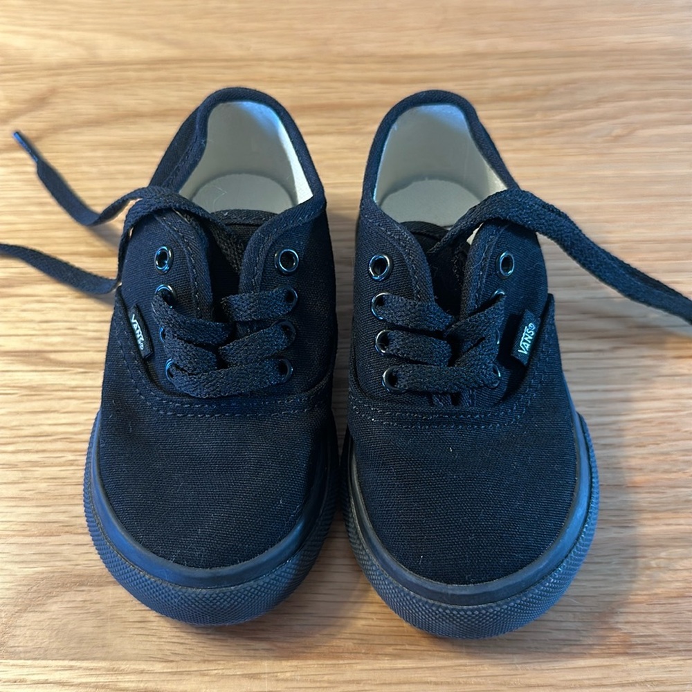 Never worn. Black lace up Vans. Toddler size 6